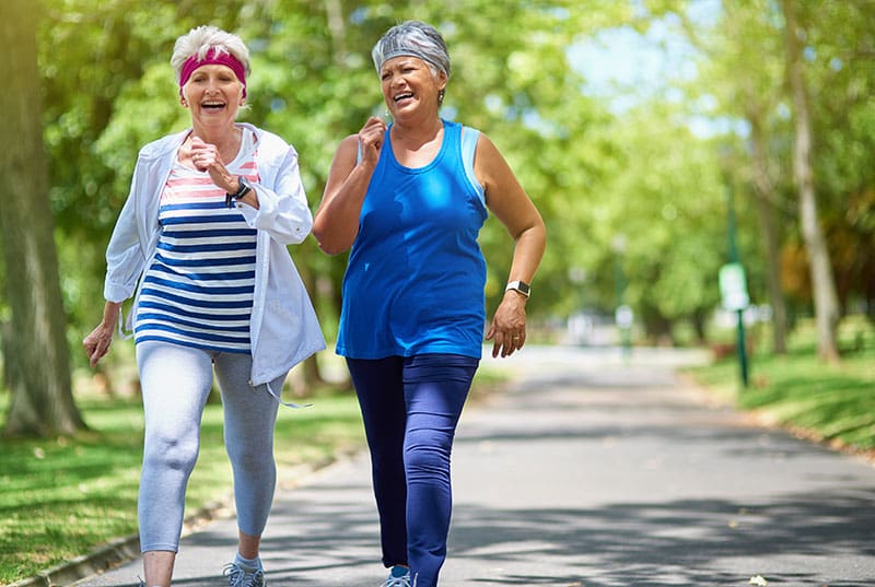 independent senior women on a walk outside