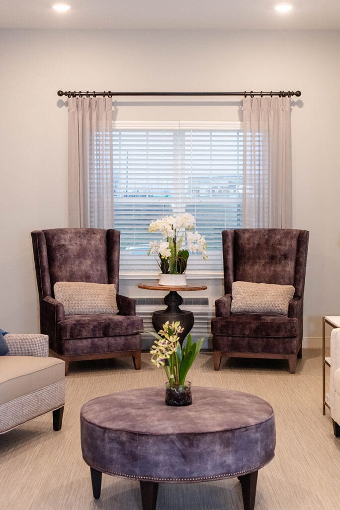 seating area with arm chairs in front of window