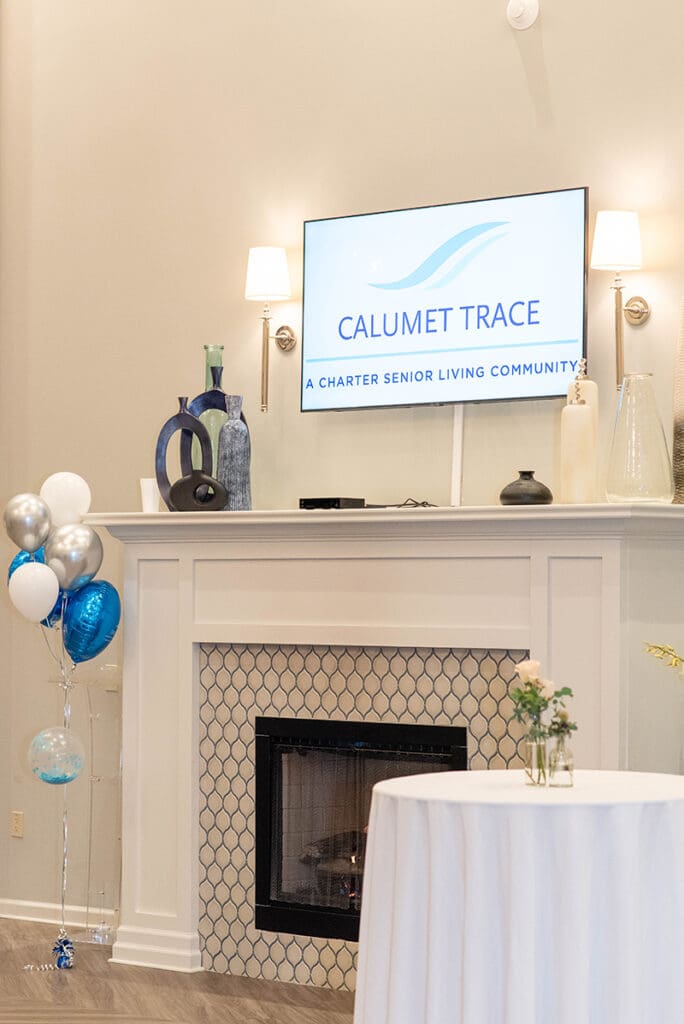 Charter Senior Living of Calumet Trace sign above fireplace